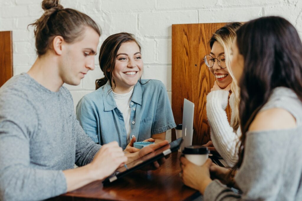 image for business card ideas A group of friends at a coffee shop